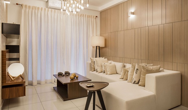 Contemporary living room interior with premium finishes at Prestige Mysore Road apartments, Bidadi